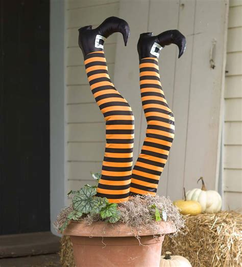 Witch figurine with stakes for halloween decor